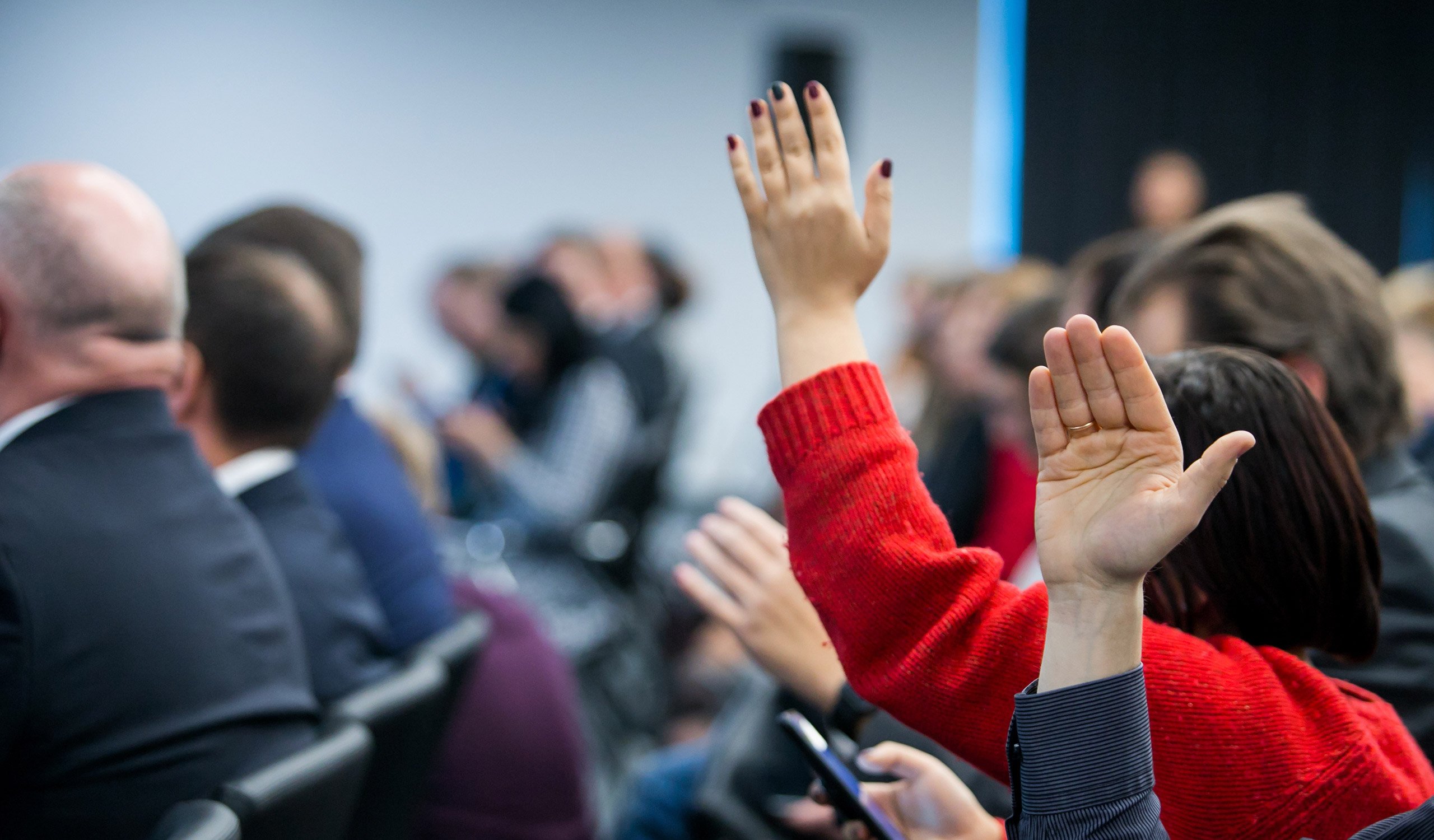 raising hand during seminar