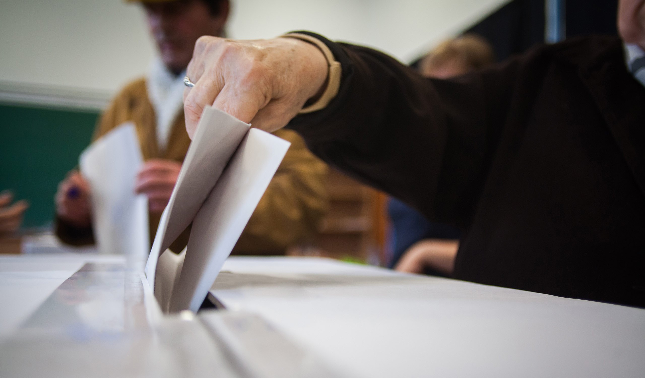 Man submitting his vote